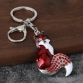 Detail of red enamel fox keychain with sparkling crystals and silver lobster clasp - Silver Base Red