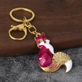 Detail of fox keychain featuring purple enamel and rhinestones with lobster clasp - Antique Gold Rose Red