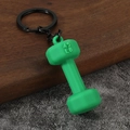 Close-up of a green dumbbell keychain with 45 LB engraving and black metal chain - Green