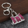 Detail of silver alloy handbag keychain with sparkling pink rhinestones and lobster clasp - Silver Red Zircon
