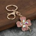 Portachiavi di lusso a quadrifoglio dorato con strass rosa e cristalli scintillanti - Rosa