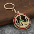 Portachiavi dorato con moschea, luna, smalto verde e bordo di strass rossi - Rosso
