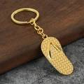 Creative gold flip-flop keychain accessory with textured sole and polished metallic finish - Gold