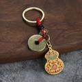 Porte-clés chinois avec pendentif gourde dorée et pièces de monnaie sur cordon rouge - Gourde Porte-Bonheur Avec Corde Rouge