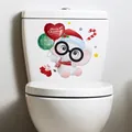 Cartoon elephant toilet sticker with Merry Christmas balloons for festive bathroom decor - Christmas Elephant
