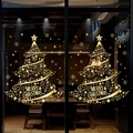 Close-up of golden Christmas tree window stickers with stars and Merry Christmas text - Combination 2