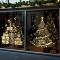 Detail of gold Christmas tree window decals with Merry Christmas text on a glass surface - Combination 4