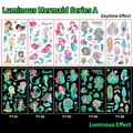 Glow-in-the-dark mermaid temporary tattoos showing daytime and luminous night effects - Luminous Mermaid Series A