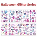 Set tatuaggi glitterati Halloween con teschi e zucche in tonalità viola e rosa brillante - Serie Halloween Glitterata (Set di 10)