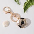 Funkelnder Fußball-Schlüsselanhänger mit Strass und goldenem Verschluss auf weißem Grund - Fußball Weiß