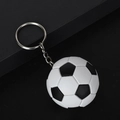 Detailed close-up of a realistic black and white soccer ball keychain on a matte display - 4.5CM / Black