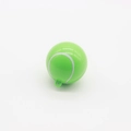 Close-up of a green tennis ball shaped container with a practical hanging ring - Green Tennis Style