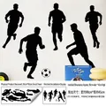 Zwarte voetballer silhouetten muurstickers met lay-out en 90x45cm display afmetingen - 30x90cm / Zwart