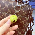 Yellow football bell keychain with China print on brown patterned bag with heart clip - 2.5cm / Smiley Face