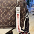 White faux leather baseball stitch keychain accessory with silver clasp on handbag - Embroidered Wrist Strap Charm / Bar / White