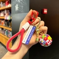 World Cup trophy keychain with red braided rope and soccer charm featuring national flags - National Flag Soccer Ball + Gold Trophy + Text Sign + Red Braid Rope