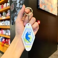 Detail of vintage acrylic tennis keychain with marble texture and athlete silhouette - Pearl Marble - Tennis