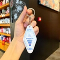 Detail of rhombic badminton keychain with blue Smash text on white pearly acrylic - Pearl Acrylic - Badminton