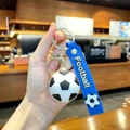 Portachiavi calcio blu con cinturino in silicone e anello dorato per gli zaini - Calcio