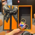 Close-up of a world cup soccer keychain with national flags in a premium orange gift box - National Flag Soccer Ball + Lobster Clasp + Premium Orange Gift Box