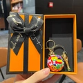 World Cup trophy and colorful soccer ball keychain set in an elegant orange gift box - National Flag Soccer Ball + Gold Trophy + Lobster Clasp + Premium Orange Gift Box