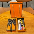 Detail of soccer themed gift set with keychain and colorful woven rope in orange box - Soccer Ball + Trophy + Sign + Multi Braid + Gift Box + Bag