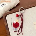 Llavero de raqueta de ping pong en acrílico con pala roja y amuleto de zapato - Tenis de mesa