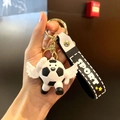Soccer ball keychain with white wings and black sport wrist strap on a metal ring - Angel Black and White Style