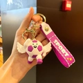 Cartoon soccer keychain with white wings and purple sport strap on a gold ring - Angel Purple Style