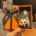 Cartoon soccer doll keychain with orange headphones in a premium gift box set - Black and White Headphone Style With Gift Box