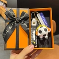 Cartoon football keychain with orange headset, sport leather strap in gift box - Black and White Headphone Style With Sign and Box