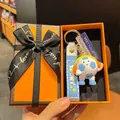 Cartoon football keychain with headset, blue strap, and orange gift box for fans - Light Blue Headphone Style With Sign and Box