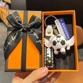 Cartoon soccer keychain with wings and sport lanyard in a luxury orange gift box - Angel Black and White Style With Sign and Box