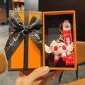 Cartoon football keychain with red wristlet in premium orange gift box with ribbon - Angel Red Style With Gift Box