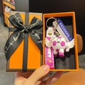 Football keychain with wings and pink silicone strap in a premium orange gift box - Angel Purple Style With Sign and Box