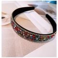 Luxury headband featuring vibrant rainbow rhinestones set on a classic black base - Rainbow