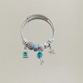 Detail of silver cable bracelet with blue star lock and jeweled key charms - Silver Blue Star Key Rhinestone Bracelet