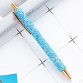 Blue glitter ballpoint pen with rose gold metallic accents and retractable click mechanism - Blue