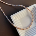 Baroque colorful pearl necklace with orange, purple, and gray tones on a stone display - 2-5#14 Pearl Necklace Mixed Colors 4-5mm