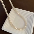 Elegant natural baroque pearl necklace with high luster on a white geometric display stand - 2-8#10 Pearl Necklace 6-7mm
