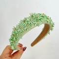 Detail of light green floral headband with tiny rhinestones on small daisy petals - Light Green