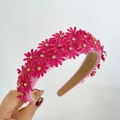 Detailed view of pink floral headband with handmade daisies and sparkling rhinestones - Rose Red