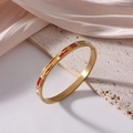 Golden 6mm titanium steel bangle with red, yellow, and white enamel geometric patterns - Red/Yellow/White Geometric (J26)