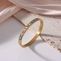 6mm gold titanium steel bangle featuring colorful floral enamel patterns on pink silk - Vibrant Retro Floral (J53)