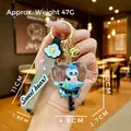 Detailed view of acrylic heart-shaped keychain with cute panda and blue moving quicksand - Heart Key Snow Panda