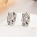 Close-up of silver-tone hoop earrings with triple rows of micro-pave cubic zirconia stones - 19