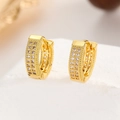 Macro detail of gold-plated hoop earrings with rows of sparkling zircon stones - 18