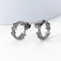 Detailed view of gunmetal lightning bolt earrings with pavé set white zircon stones - 30