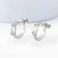 Macro detail of silver screw-on clip earrings with marquise-cut zircon and pave crystals - 27