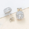 Macro detail of silver round halo stud earrings with micro-paved cubic zirconia stones - 12